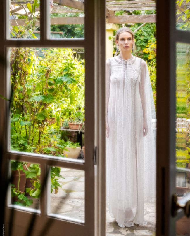 fairytale wedding dress woman behind door