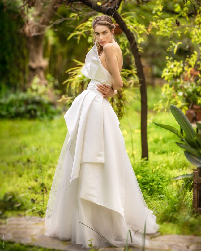 swan wedding dress woman in front of tree
