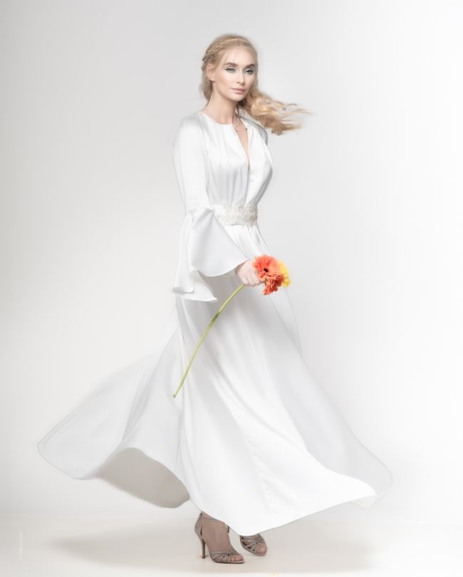white dress woman holding flower